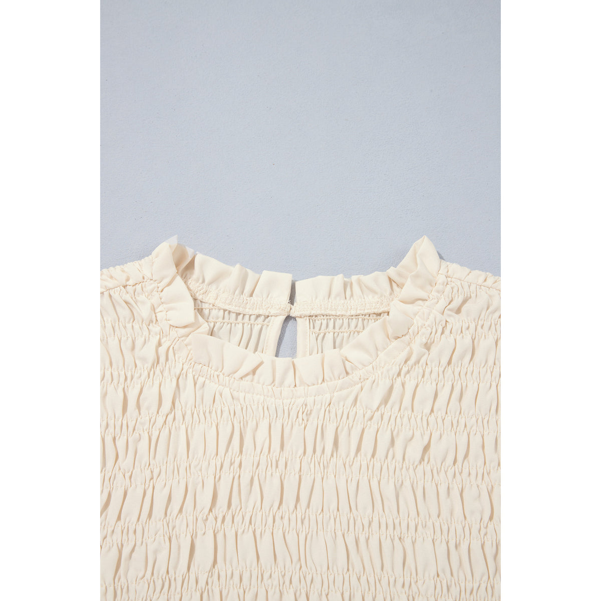 Ivory Smocked Blouse with Balloon Sleeves in Jet Stream - smocked neckline detail